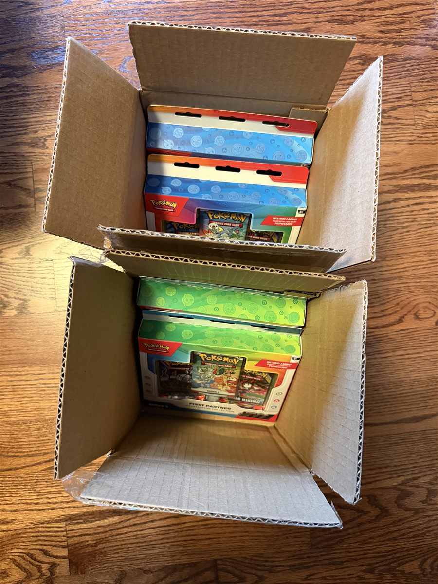 Pokemon collections packed in cardboard boxes